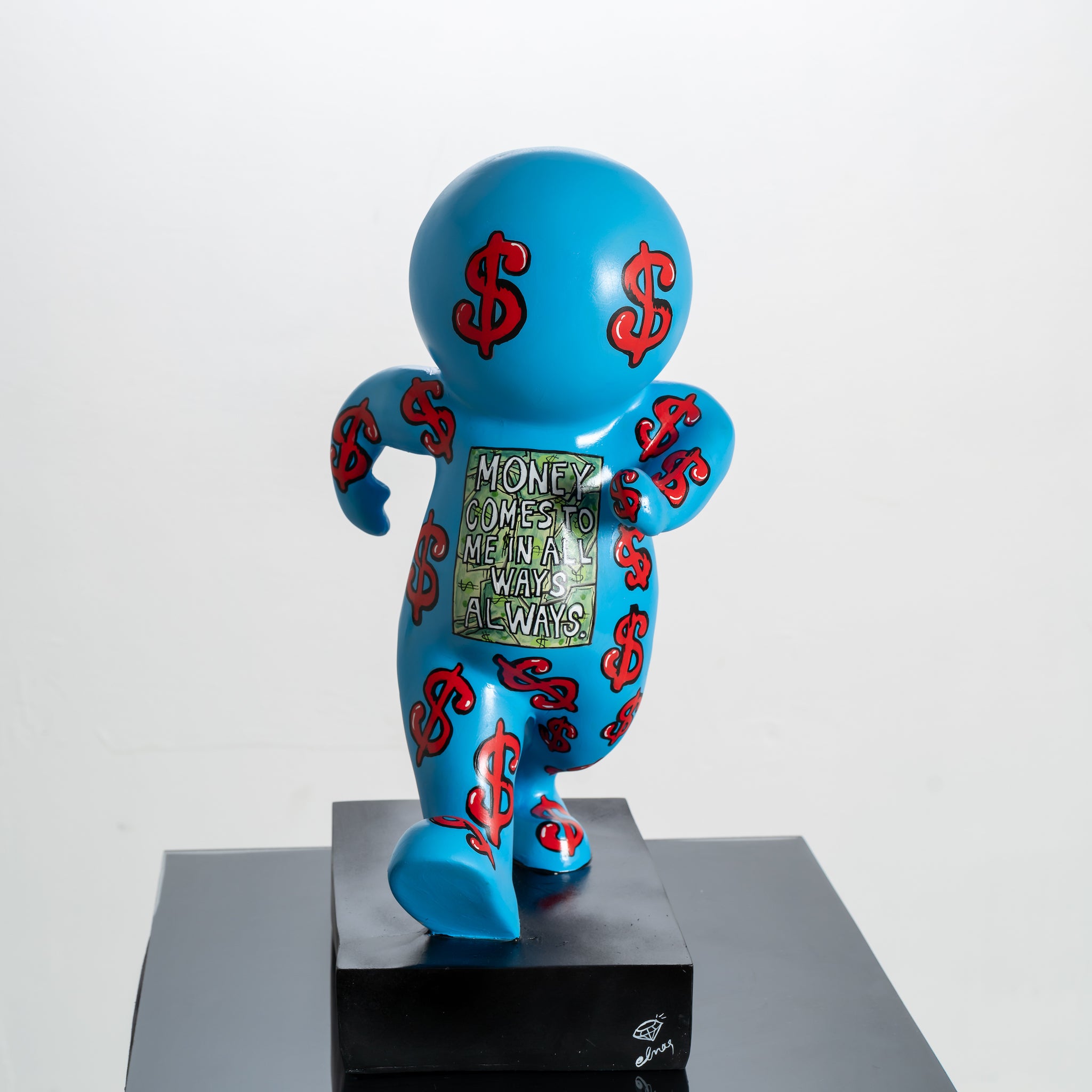 Blue figurine with red dollar signs on a white background